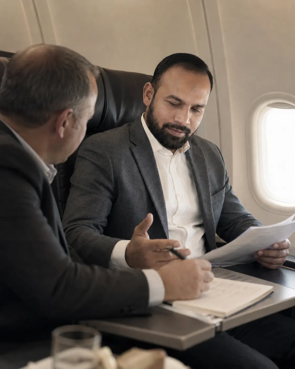 Jamil Ahmad Mayo reviewing plans during business travel